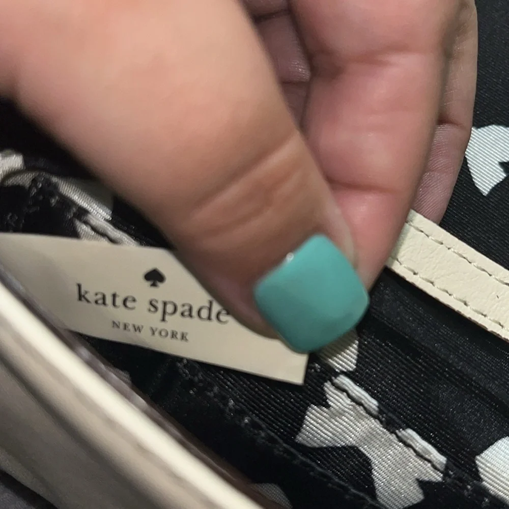 Kate Spade New York Cream Leather & Black Bow Tie Clutch